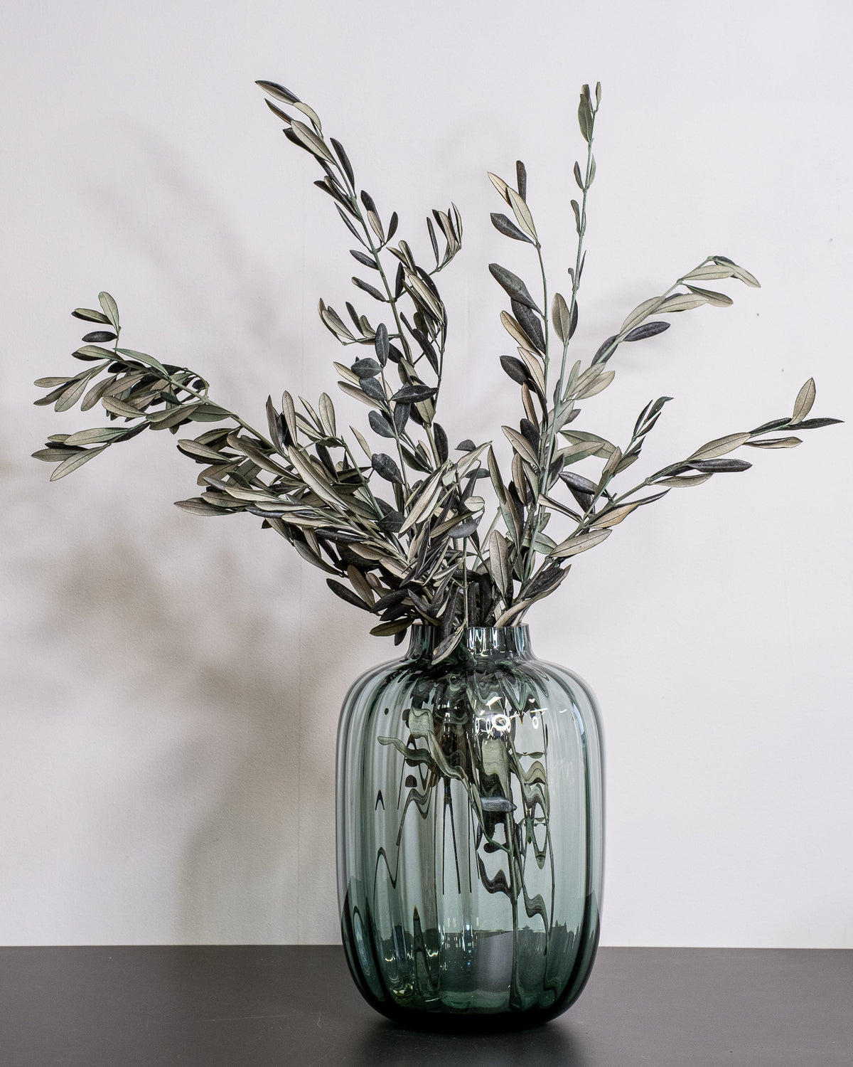 Preserved olive with naturally green leaves