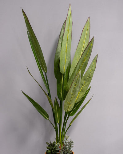 Detaljbild av Konstgjord Heliconia krukväxt med melaminkruka – 90 cm